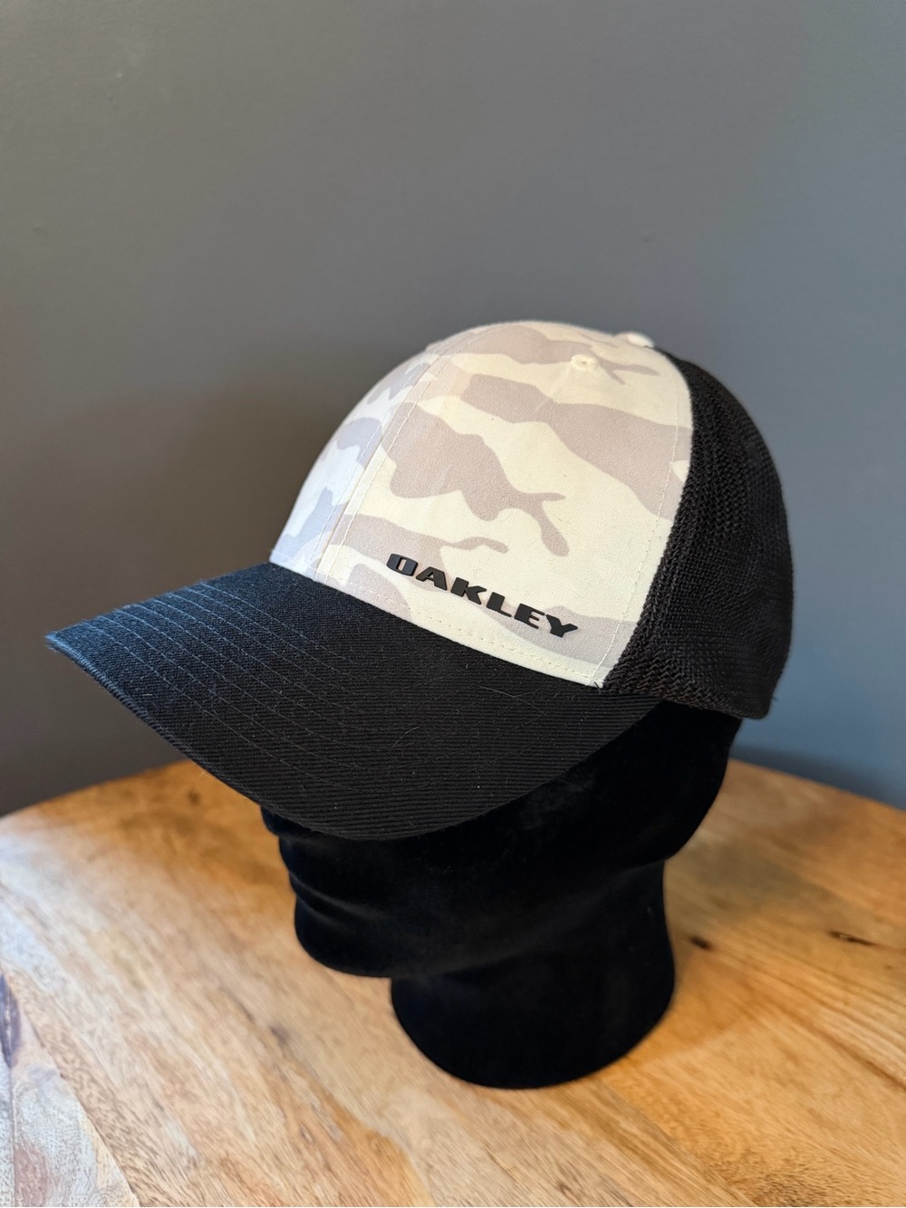 Oakley Men’s Black Brim Trucker Hat with Gray Camo Front